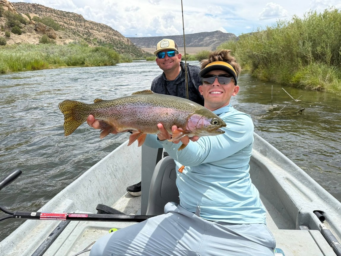 Rainbow trout landed from a drift boat on the San Juan River with Wild Out Pro Guide Service